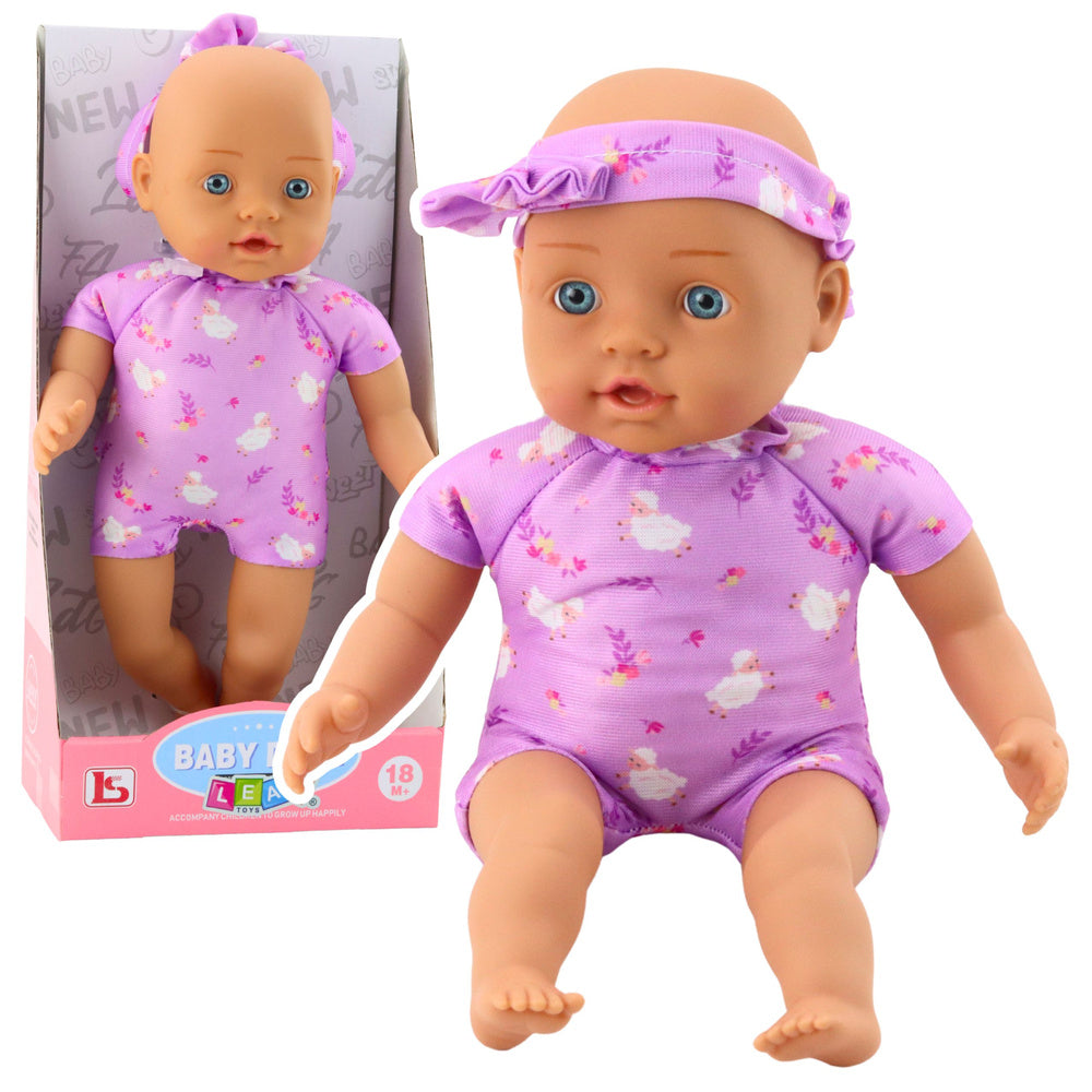 Lalka Niemowlę w Fioletowym Body Miękki Brzuszek Opaska Z Kokardką 31 cm